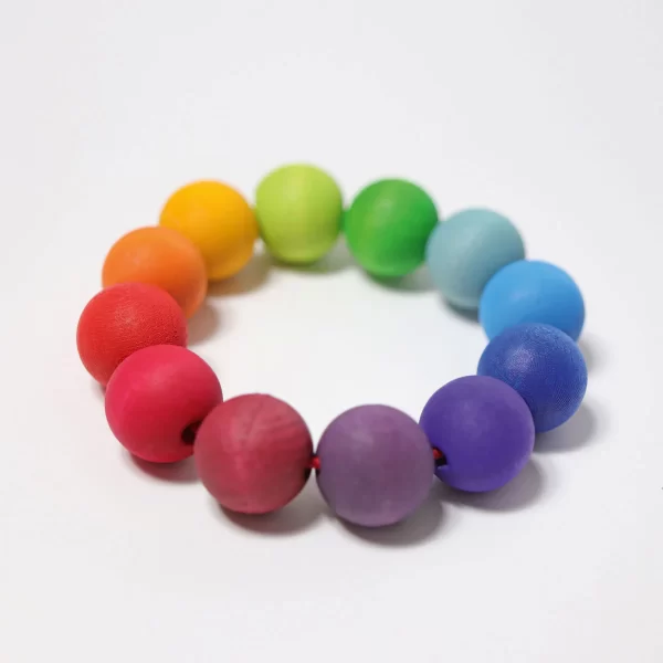 anello-di-palline-arcobaleno-di-legno-wood-pearl-grimms-08110